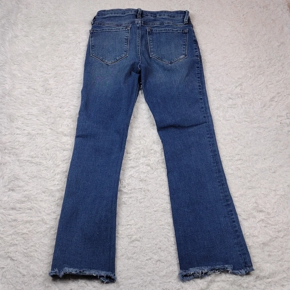 Free People Blue Medium Wash Five Pocket Mid Rise Raw Hem Cropped Boot Cut Jean